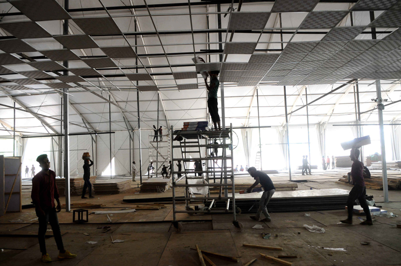 New Delhi: Workers constructing temporary COVID-19 care centre