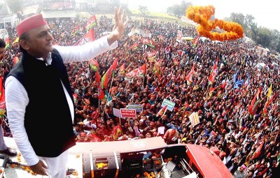 Akhilesh Yadav waves to supporters during tour to five Assembly constituencies in UP