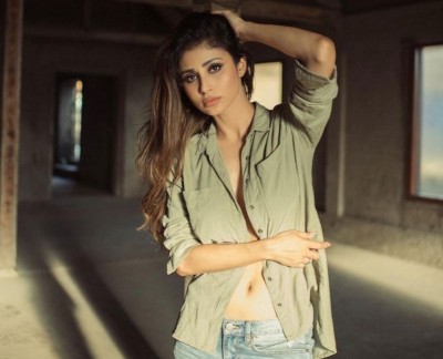 Mouni Roy scorches social media with open button olive green shirt pictures