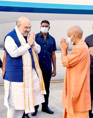 Home Minister Amit Shah pays tribute to freedom fighter Madan Mohan Malviya, meets Adityanath