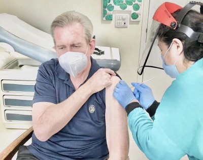 Australian High Commissioner to India in New Delhi Barry O'Farrell takes Covid-19 vaccine shot