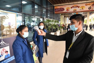 Passengers undergo thermal screening at Patna airport