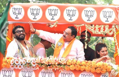 J P Nadda waving supporters during road show for Babul Supriyo in Kolkata