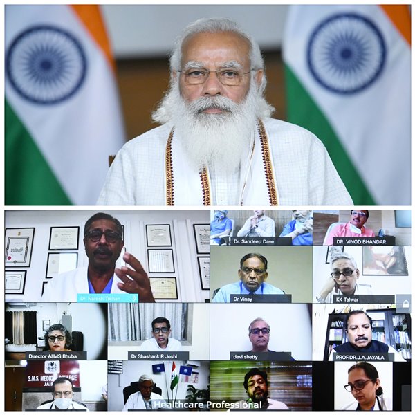 PM Modi interacts with healthcare professionals through video conferencing in Delhi