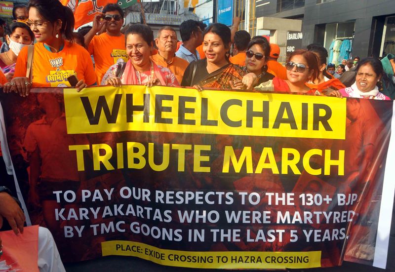 BJP workers in a 'Wheelchair Tribute March' attacking West Bengal CM Mamata Banerjee