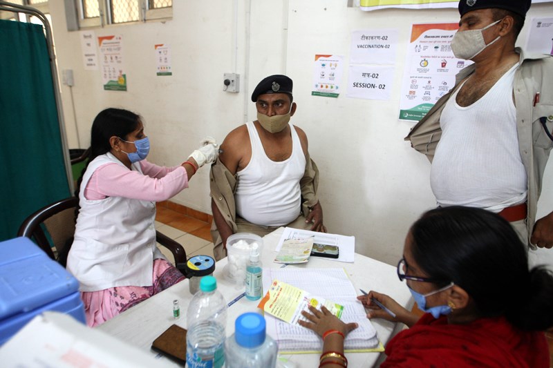Officer receiving COVID-19 vaccine in Prayagraj