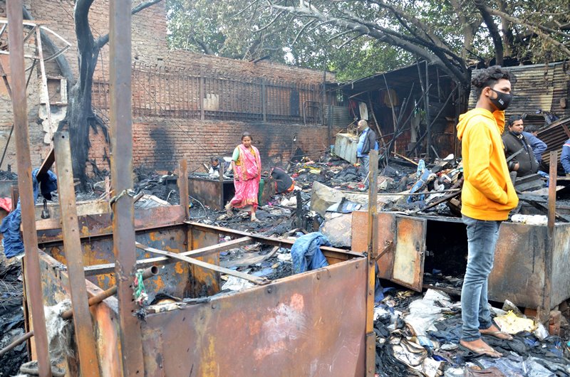 Firefighters extinguishing fire at Delhi's Lajpat Rai market