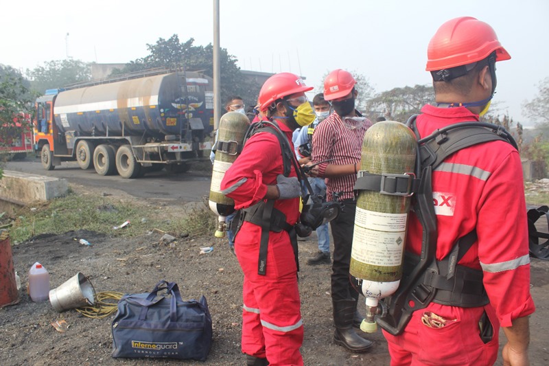 Officials clearing the site of chemical leak from tanker in Gujarat's Surat