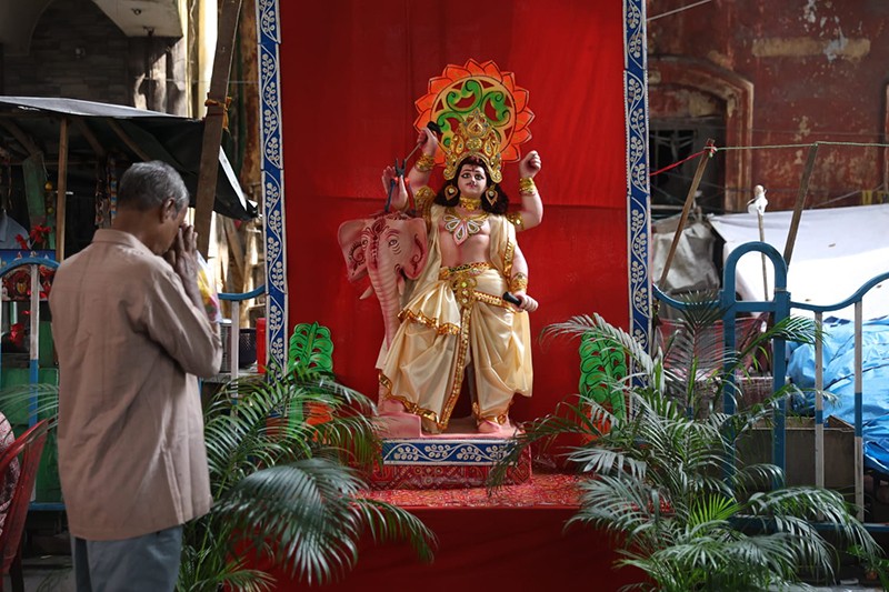 Priest offers prayers to taxi during Vishwakarma Puja in Kolkata
