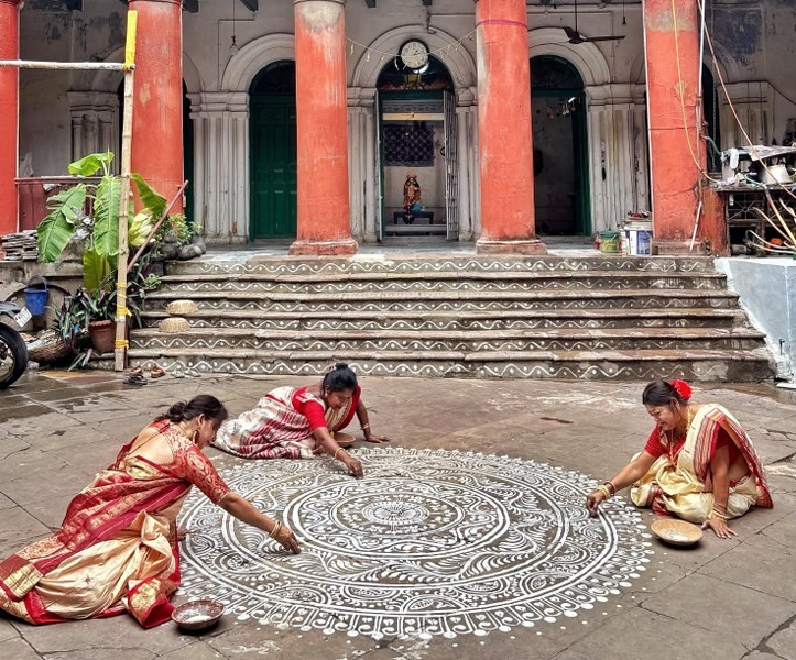 In Images: Women in Kolkata create alpana to celebrate Laxmi Puja