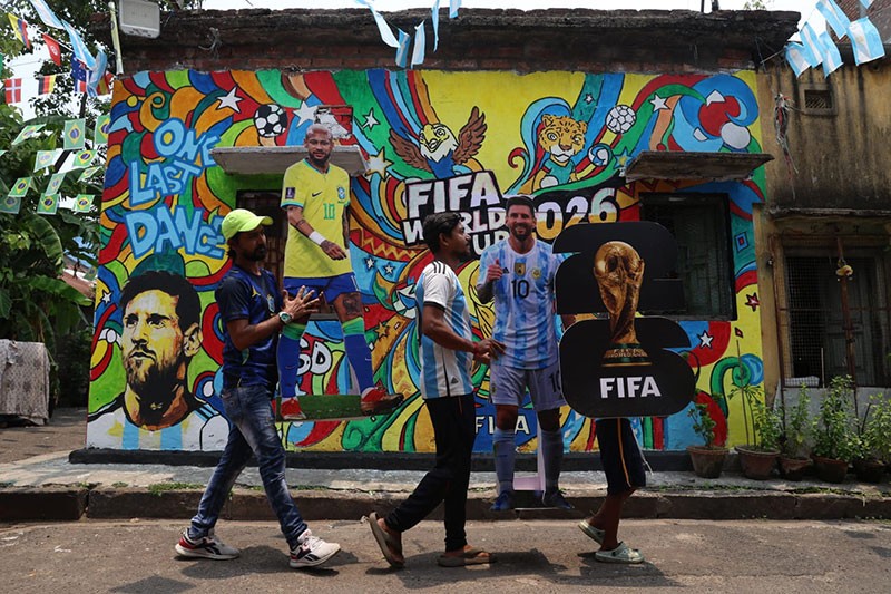 In Images: Children in Kolkata play beneath a giant World Cup masterpiece