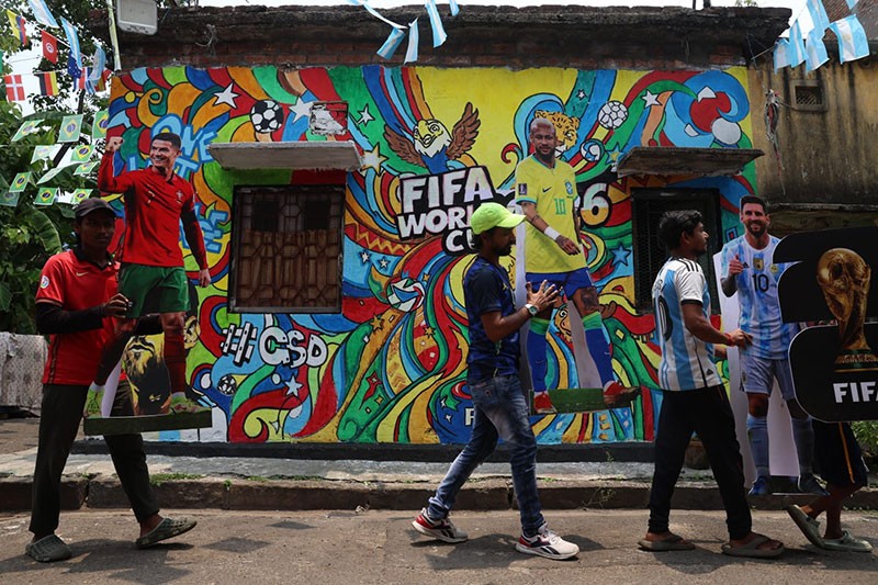 In Images: Children in Kolkata play beneath a giant World Cup masterpiece
