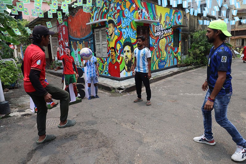 In Images: Children in Kolkata play beneath a giant World Cup masterpiece