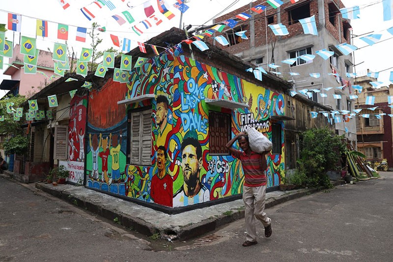 In Images: Children in Kolkata play beneath a giant World Cup masterpiece