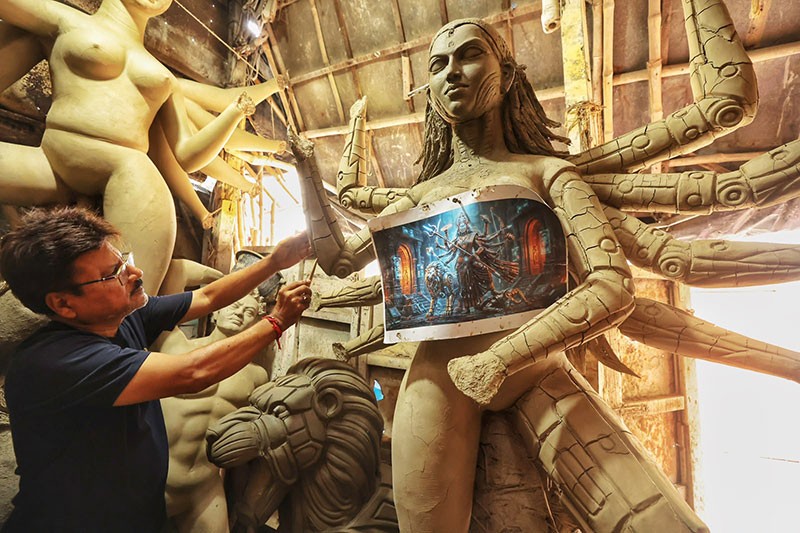In Images: AI Meets Tradition: Kumartuli Artist Creates AI Robot Durga for Durga Puja 2026