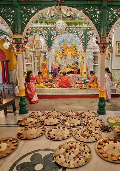 In Images: Kala Bou snan performed at Kolkata ghats on Durga Puja Maha Saptami