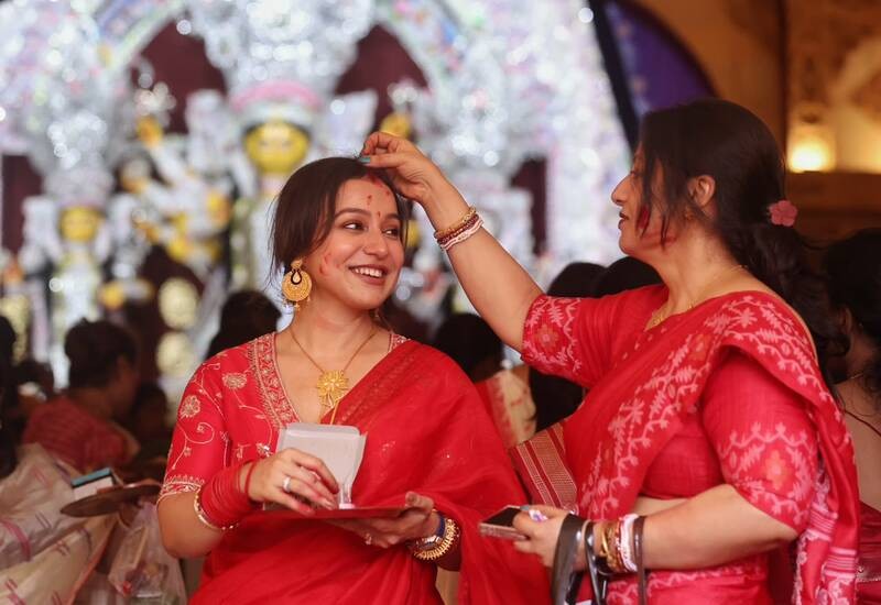 In Images: Sindoor Khela, idol immersion mark Bijoya Dashami in Kolkata