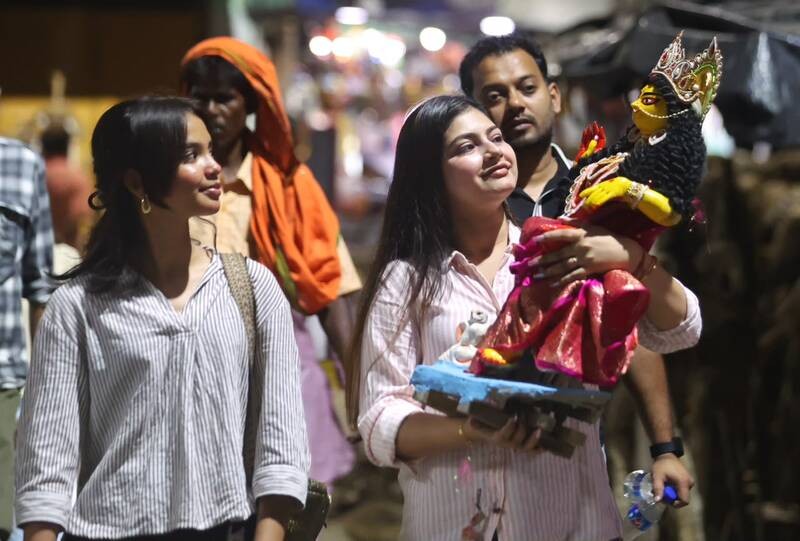 In Images: Kolkata gears up for Lakshmi Puja with idol sales at Kumartuli, alpana decorations at homes