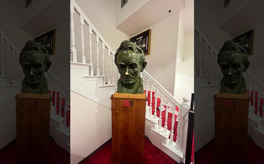 A bust of Lincoln beside a staircase in Ford