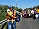Hungary urged to halt campaign portraying refugees and migrants as 'invaders' - UN agency and partners