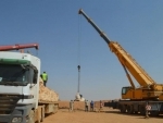 UN team in Jordan uses cranes to hoist relief aid to Syrian refugees at sealed border