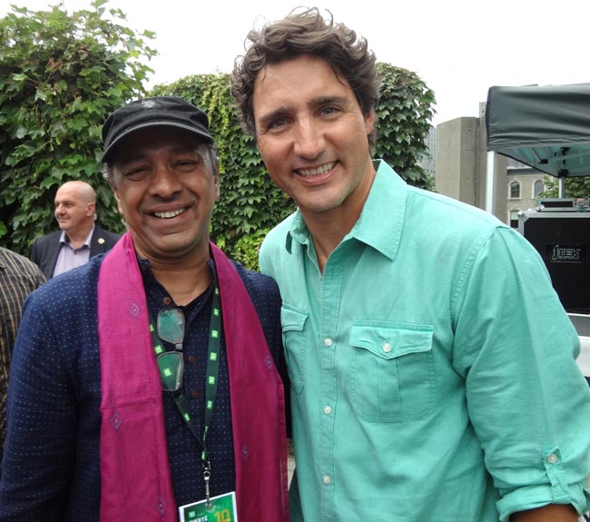  Canada PM Justin Trudeau walks with Indian filmmaker Sridhar Rangayan at Montreal pride parade