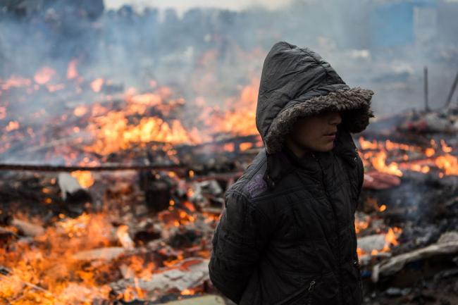 As fires burn through Calais â€˜Jungle,â€™ UNICEF urges protection of children remaining in the camp