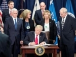 Donald Trump signs revised travel ban order, excludes Iraq