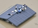At least 94 dead as heavy rain inundates Japan