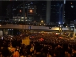 Hong Kong police fire tear gas at protesters commemorating fellow demonstrator - Reports