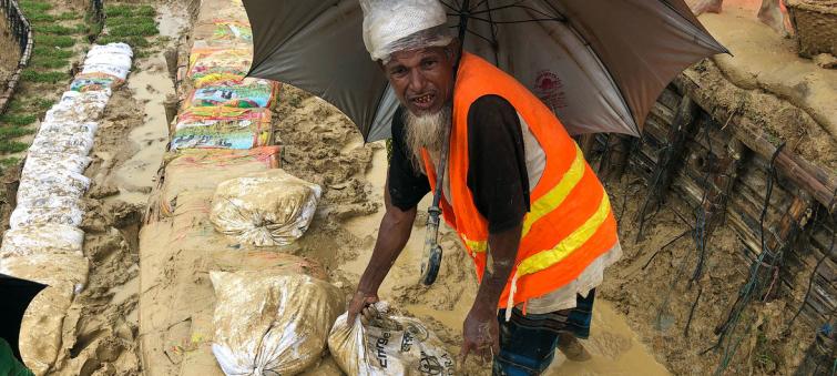 As monsoon rains pound Rohingya refugee camps, UN food relief agency steps up aid