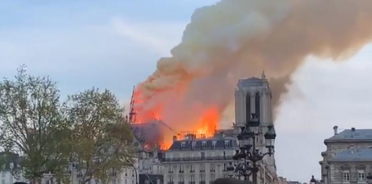 Notre Dame fire 'under control', French President Macron vows to rebuild it
