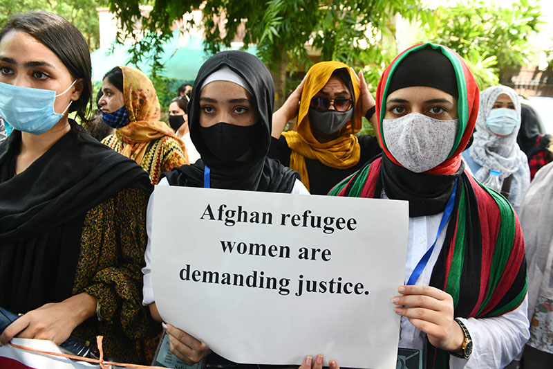 Afghanistan nationals living in New Delhi participating in a protest outside UNHCR office (United Nation High Commissioner for Refugees), in New Delhi on Monday.