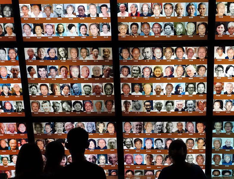 Photos of Nanjing Massacre survivors at Nanjing Massacre Memorial Hall in China. Image by Kevin Dooley via Wikimedia Creative Commons