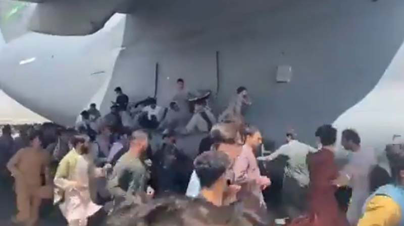 Afghanistan crisis: Desperate scenes at Kabul airport as people cling to moving C-17 aircraft