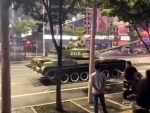 China's financial crisis: Tanks roll on Henan streets to 'protect' banks amid protests