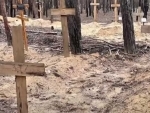 Hundreds of graves found in Ukraine, signs indicate some belong to soldiers