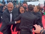 'Topless' woman crashes Cannes Red Carpet to protest against sexual violence in Ukraine, removed