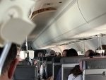 American Airlines plane drops 15,000 feet in 3 minutes, passengers say experience was 'scary'