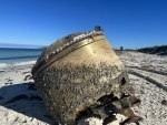 Australia: Mysterious object washes ashore  western coast, locals speculate it is space junk 