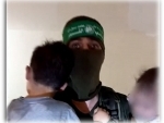 Armed Hamas members are seen playing with abducted Israeli children in IDF-released video