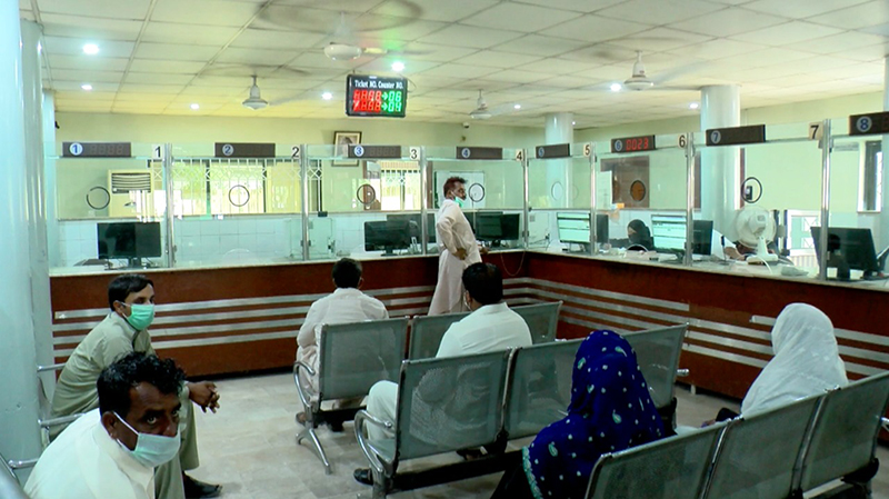 Pakistanis wait in the land records station in Lahore to look up digitised records. Pakistan and India both are working to digitise land records to make them easier to access and reduce disputes and corruption.(Shiraz Hasnat)