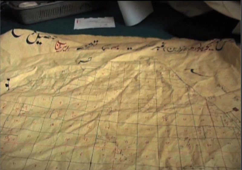 Some early land records were kept on cloth, such as the piece of cloth shown here at the land records station in Lahore, Pakistan. Pakistan and India both are working to digitise land records to make them easier to access and reduce disputes and corruption. (Shiraz Hasnat)